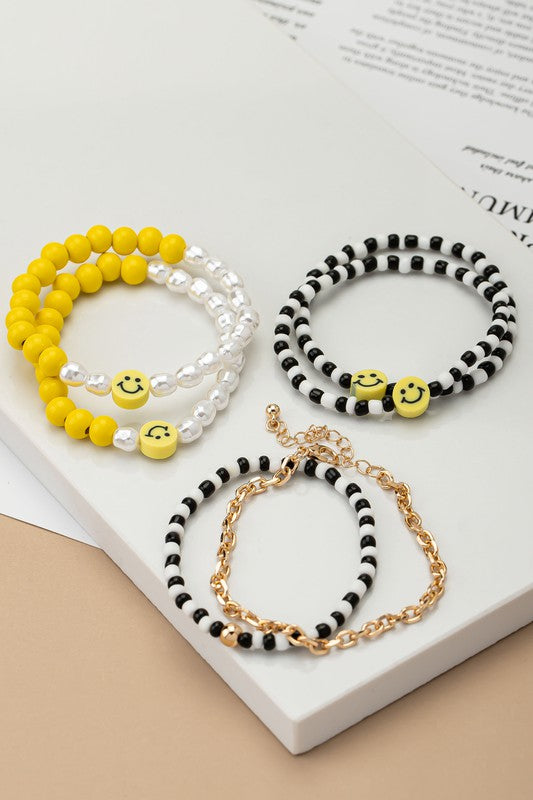 6 beaded bracelets set with polymer smiley face