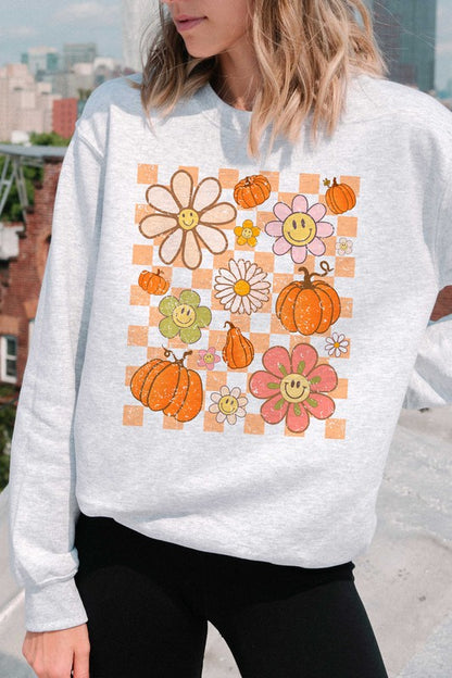 CHECKERED PUMPKINS AND DAISIES GRAPHIC SWEATSHIRT